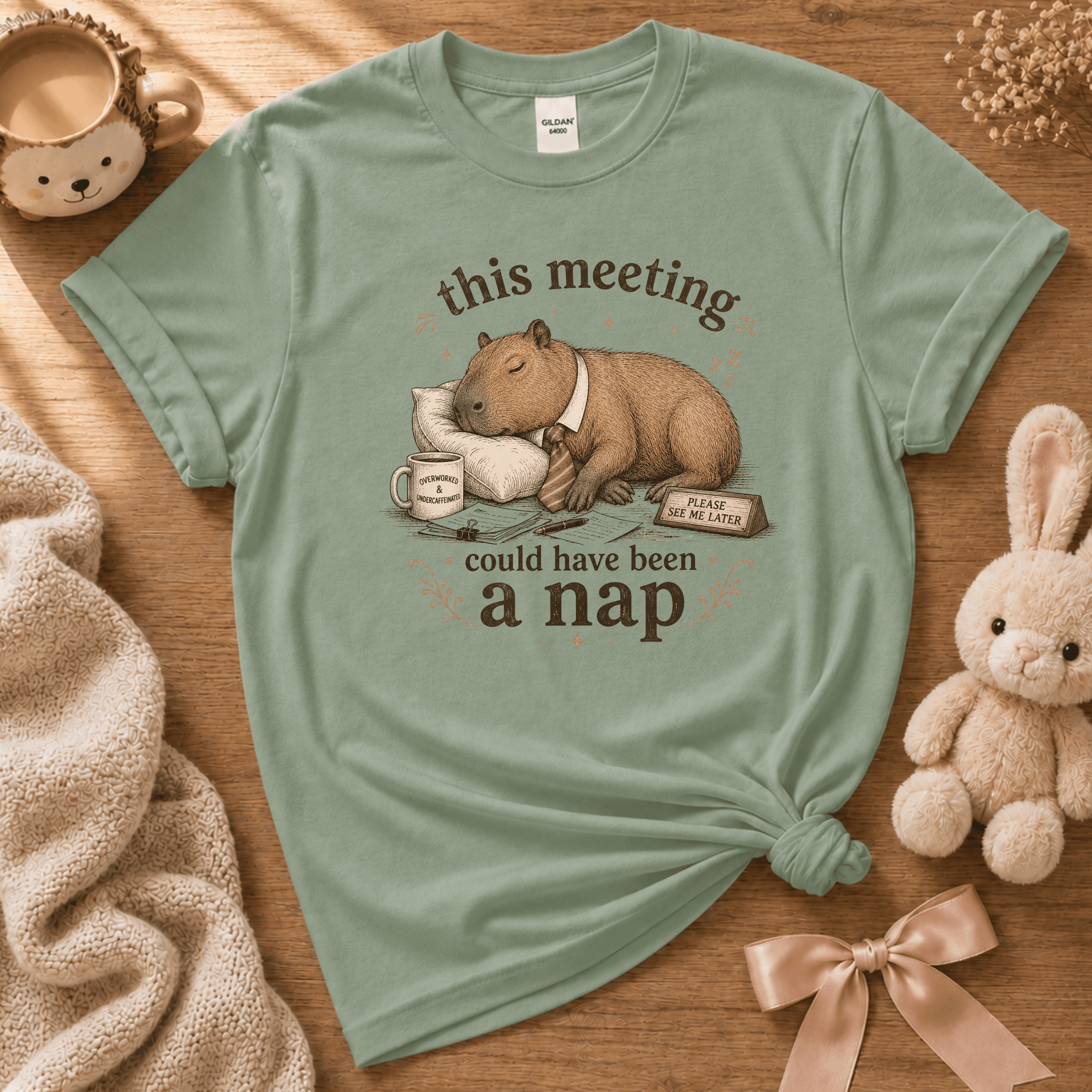 This Meeting cute animal graphic t-shirt cozy flat lay in sage.