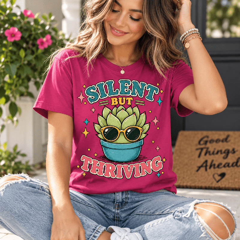 Woman wearing the Silent But Thriving Premium T-Shirt in berry