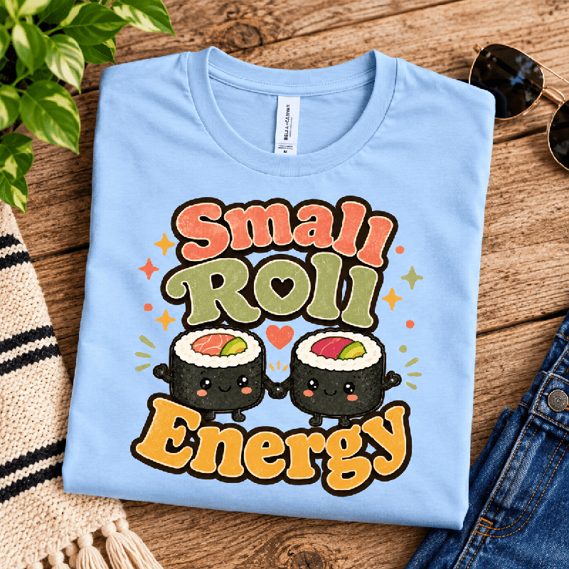 Small Roll Energy Premium T-Shirt in baby blue, folded close-up with neck tag showing