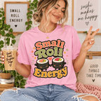 Woman holding an iced coffee, wearing the Small Roll Energy Premium T-Shirt in pink