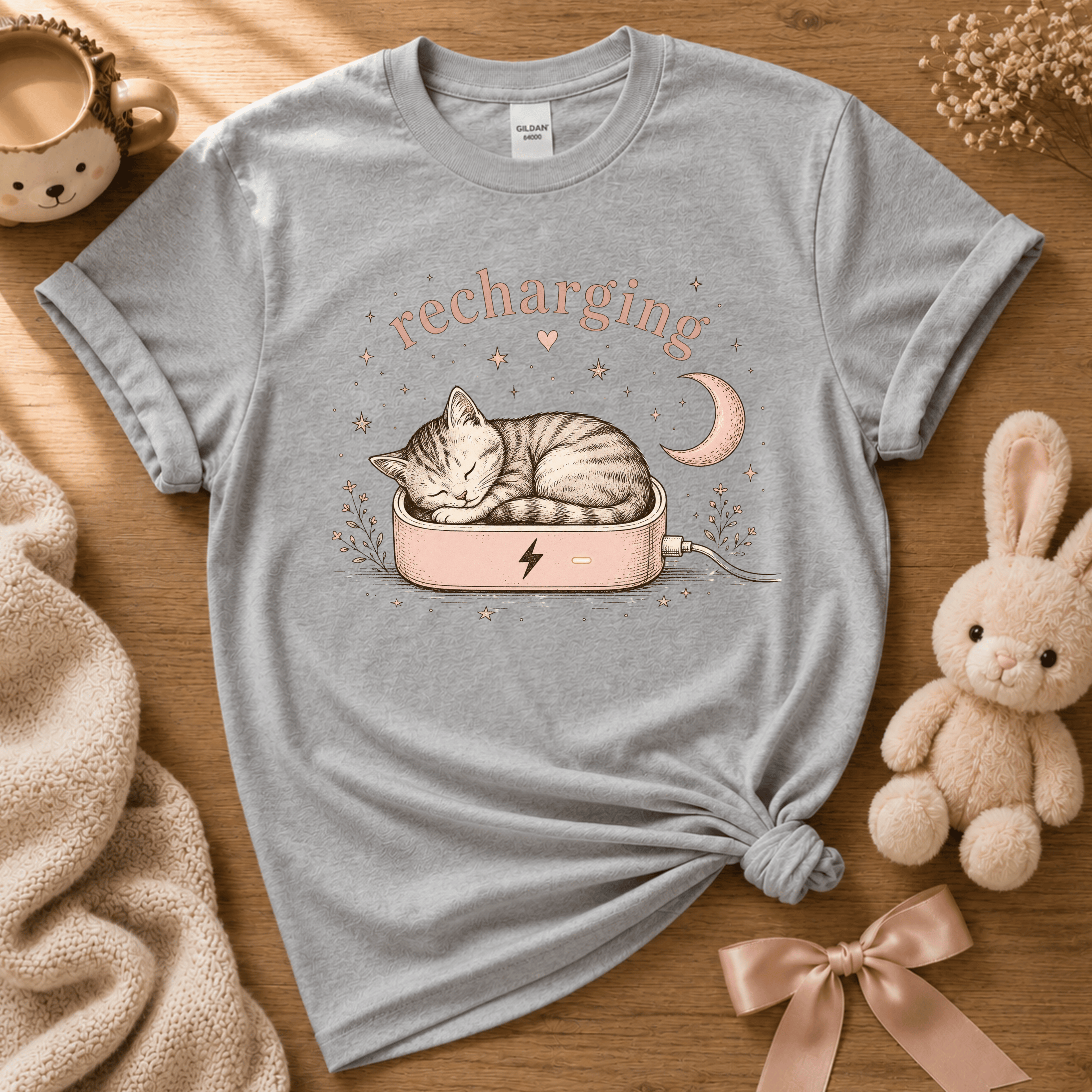 Recharging Cat cute animal graphic t-shirt cozy flat lay in sport grey.