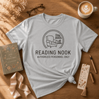 Reading Nook book lover graphic t-shirt displayed in a cozy flat lay in sport grey.