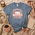 Cute Battery introvert graphic t-shirt cozy flat lay in stone blue.