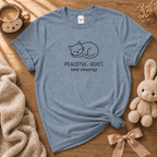 Peaceful, Quiet  cute animal graphic t-shirt displayed in a cozy flat lay in stone blue.