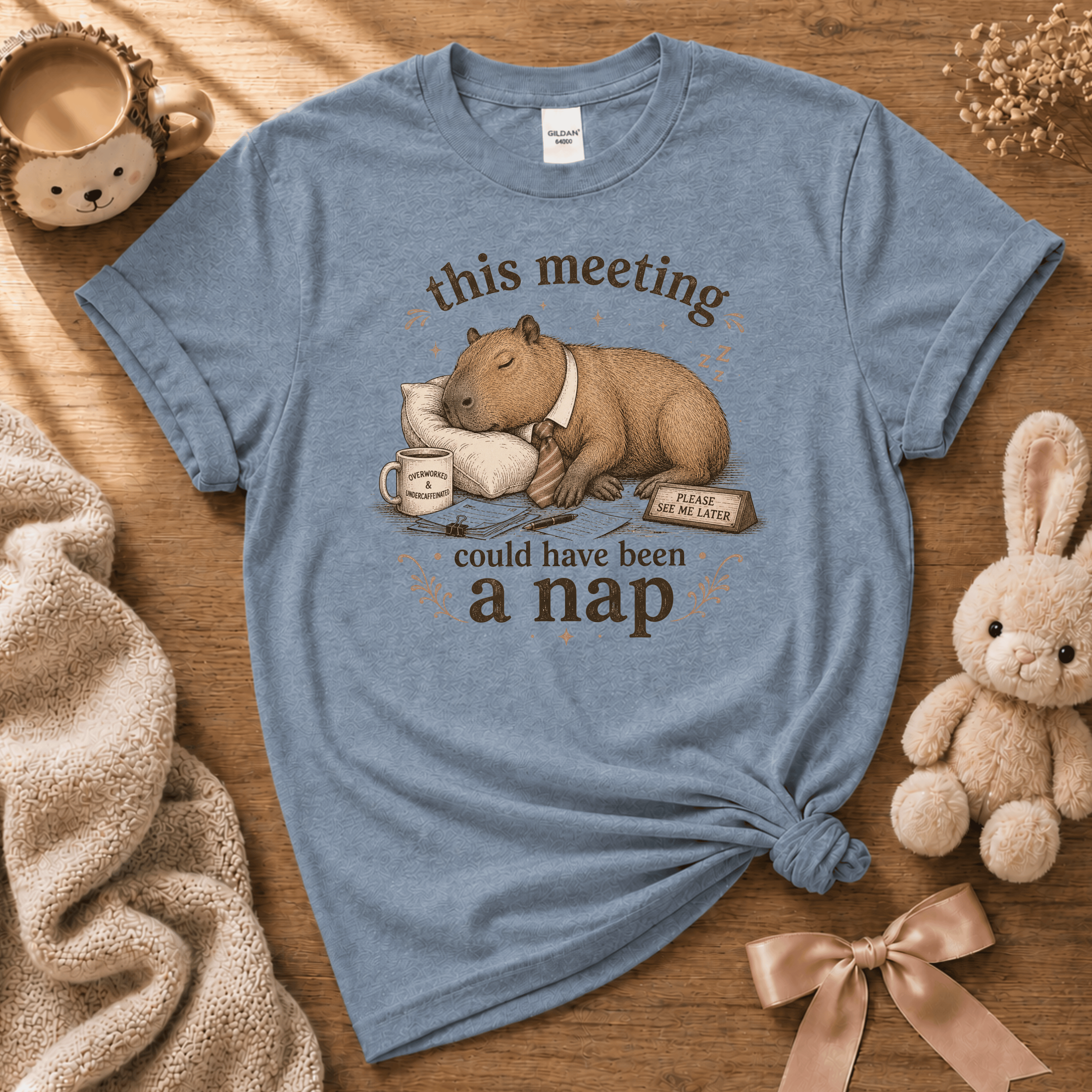 This Meeting cute animal graphic t-shirt displayed in a cozy flat lay in stone blue.
