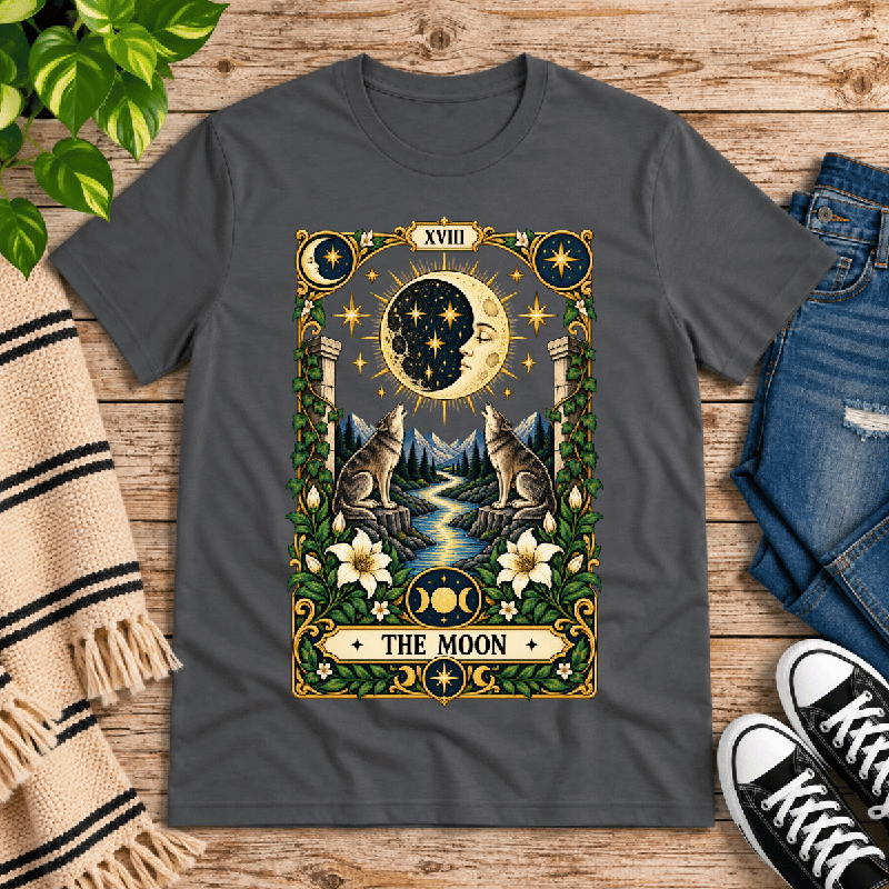 The Moon Premium T-Shirt in asphalt gray, flat lay with tarot card graphic of a moon face and howling wolves