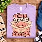 Tiny Treat Energy Premium T-Shirt in lilac, folded close-up with neck tag showing