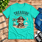 Treasure Hunter Club Premium T-Shirt in heather sea green, flat lay with pirate corgi on a beach graphic