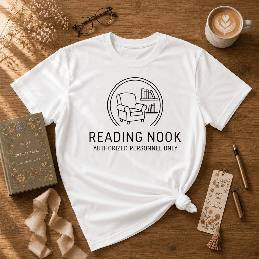 Reading Nook book lover graphic t-shirt cozy flat lay in white.