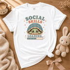 Social Skills cute animal graphic t-shirt cozy flat lay in white.