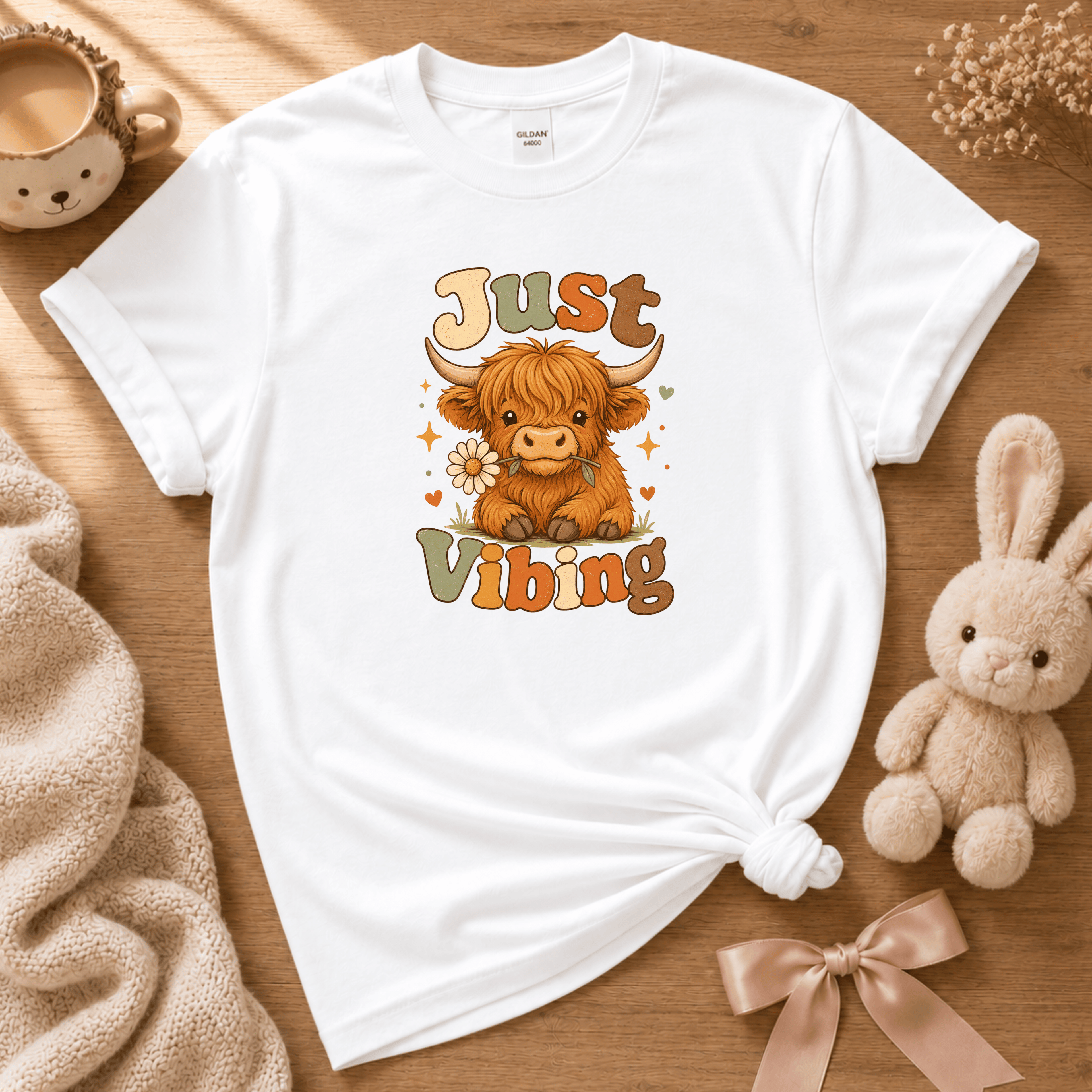 Cow Just Vibing cute animal graphic t-shirt cozy flat lay in white.
