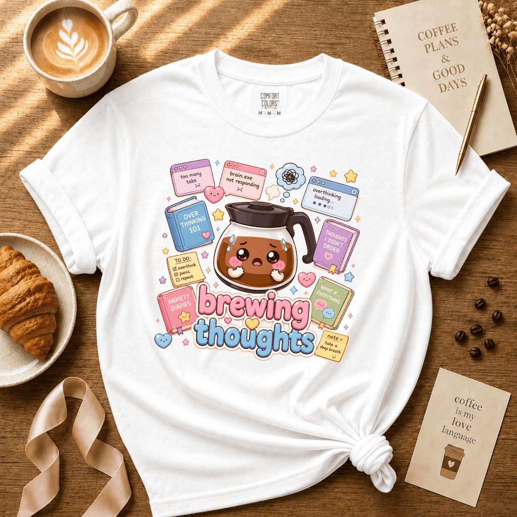 Brewing Thoughts coffee lovers graphic t-shirt cozy flat lay in white.