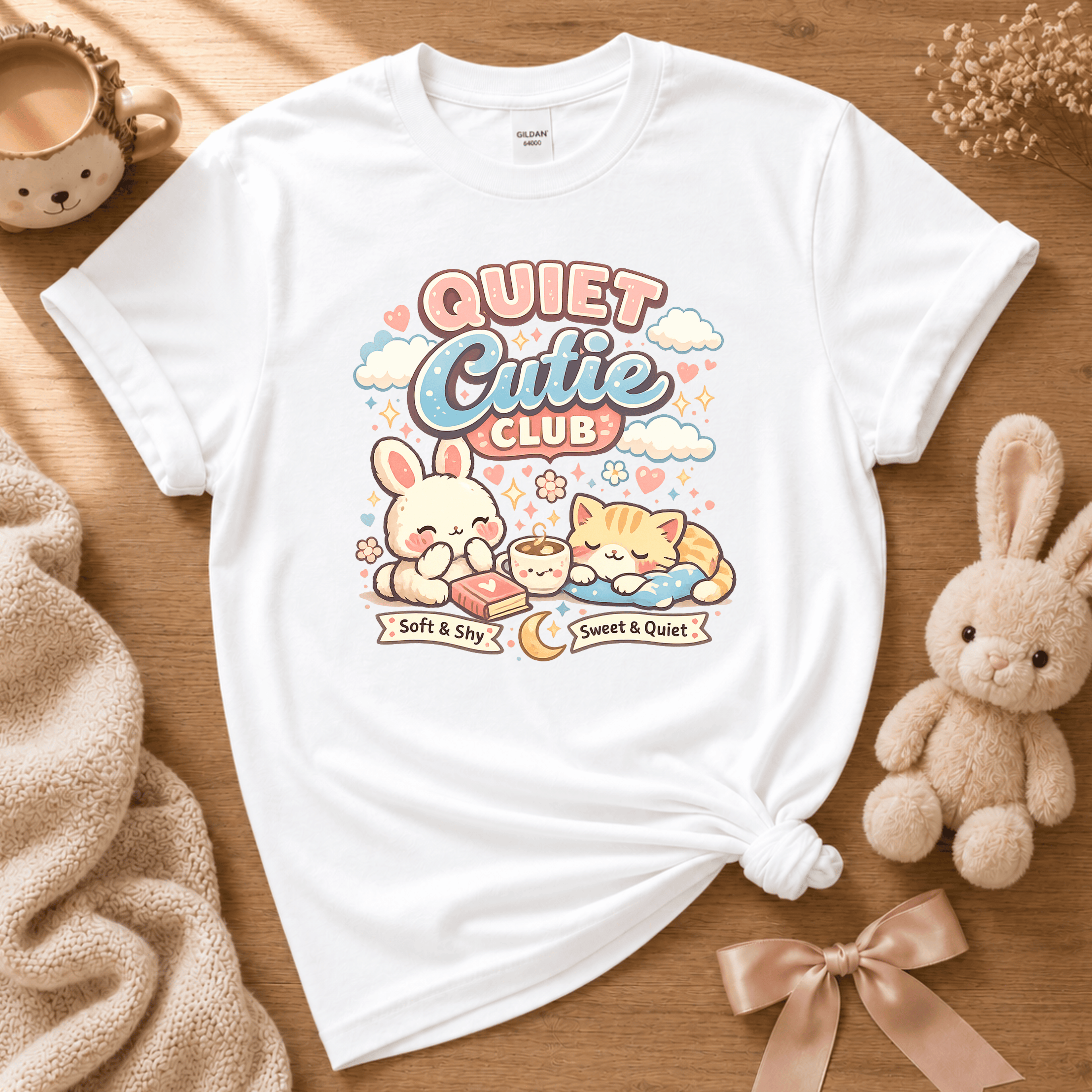 Quiet Cutie Club 1 cute animal graphic t-shirt cozy flat lay in white.