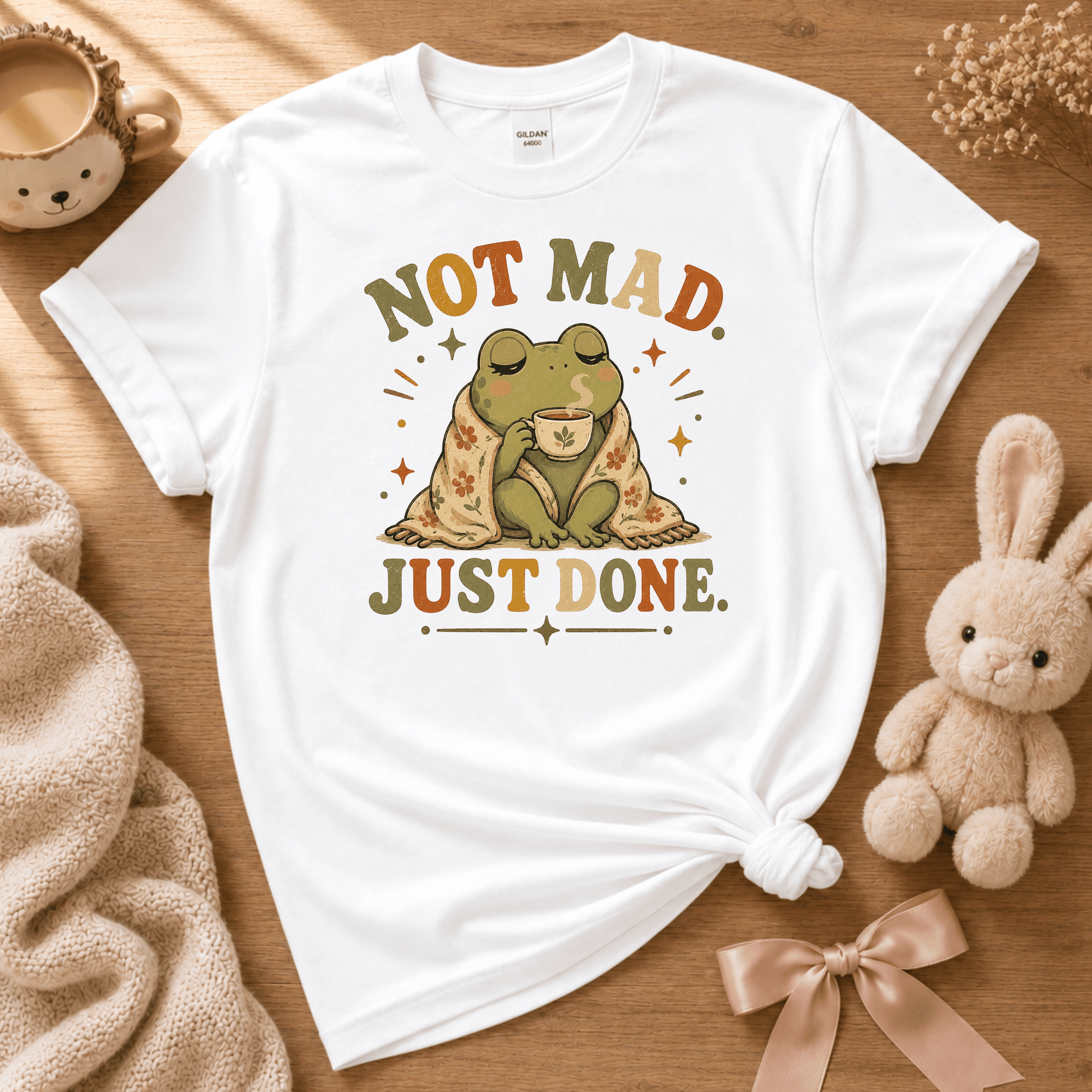 Just Done cute animal graphic t-shirt displayed in a cozy flat lay in white.
