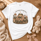 Saving Progress introvert graphic t-shirt cozy flat lay in white.