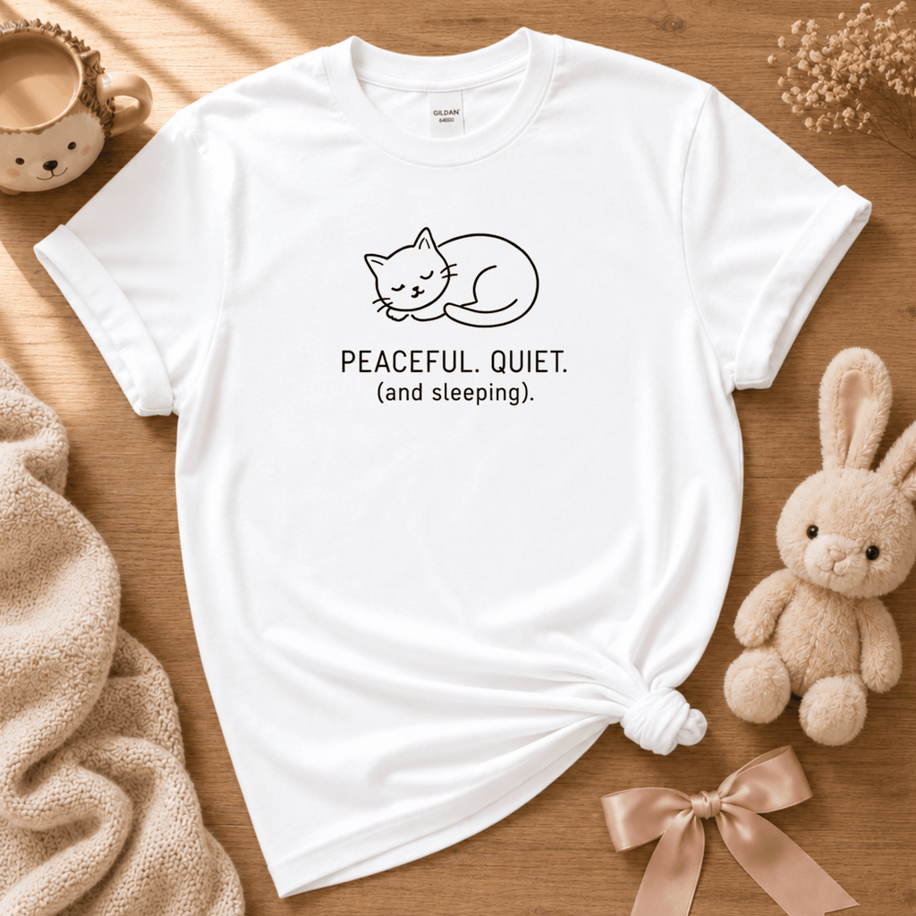Peaceful, quiet cute animal graphic t-shirt cozy flat lay in white.