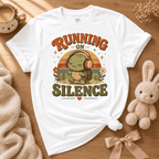 Running On Silence cute animal graphic t-shirt displayed in a cozy flat lay in white.