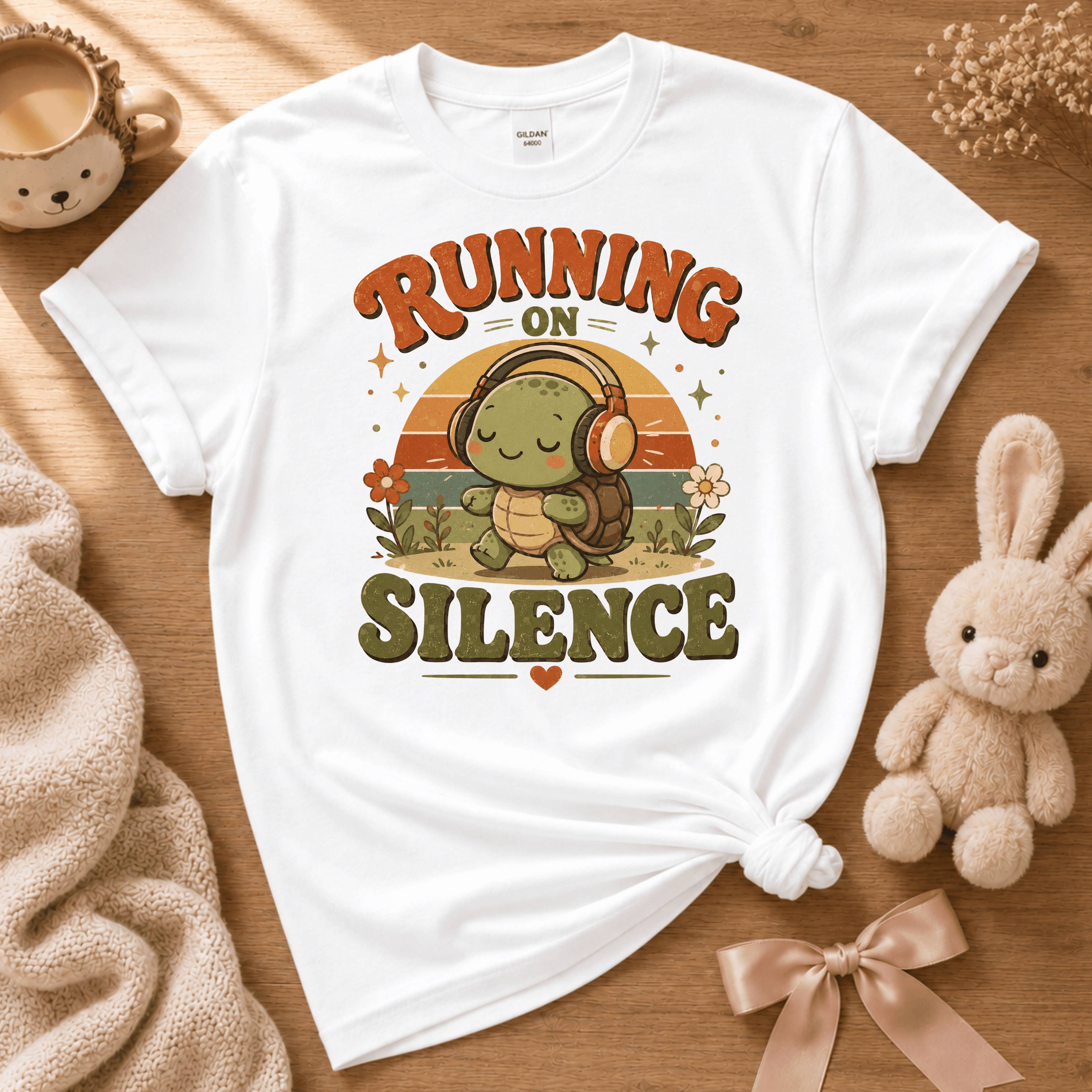 Running On Silence cute animal graphic t-shirt displayed in a cozy flat lay in white.