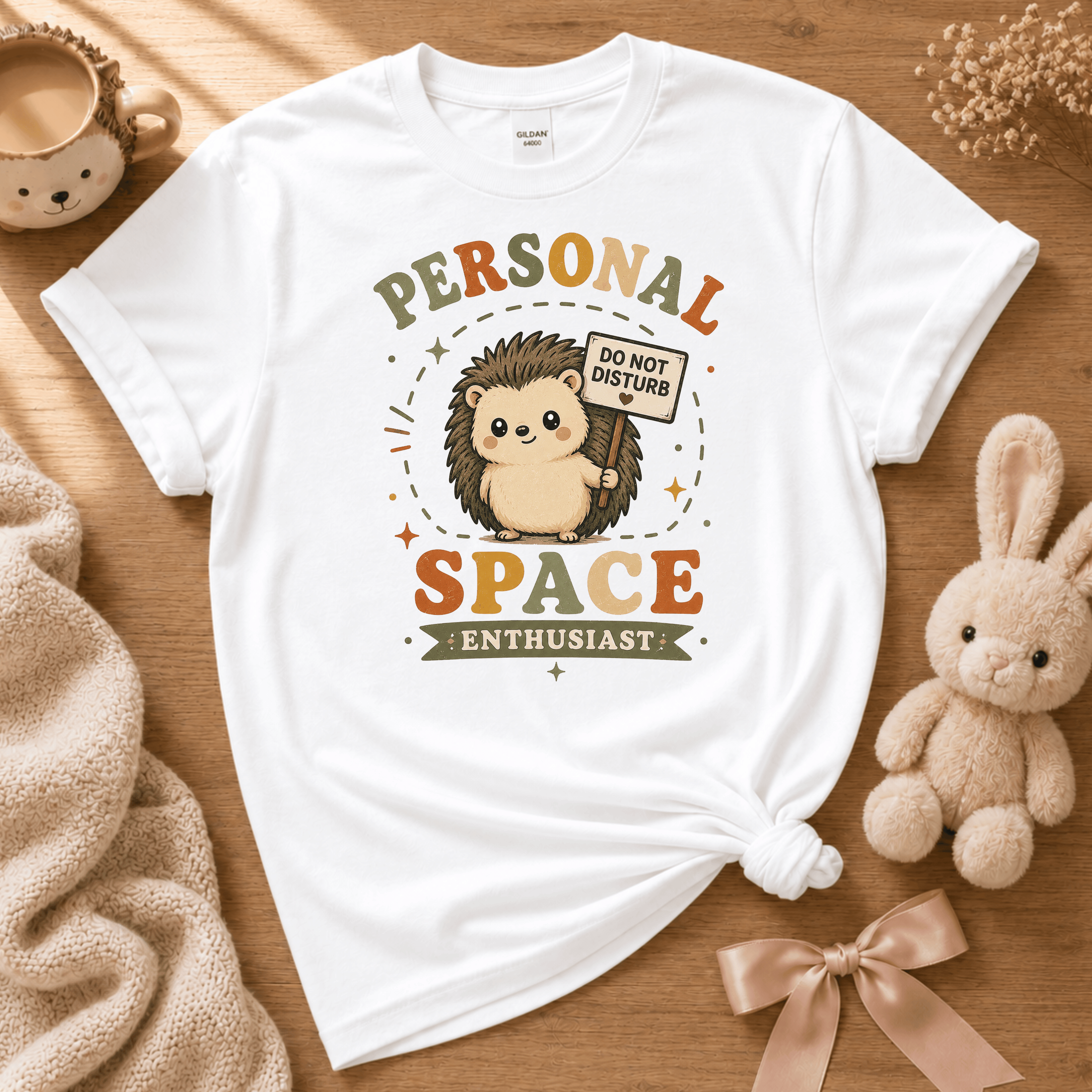 Personal Space Enthusiast cute animal graphic t-shirt displayed in a cozy flat lay in white.