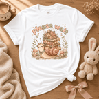 Please Wait cute animal graphic t-shirt displayed in a cozy flat lay in white.